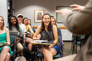 students in classroom laughing during instruction